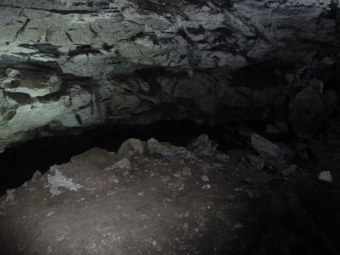 A picture containing rock, cave, stone Description automatically generated