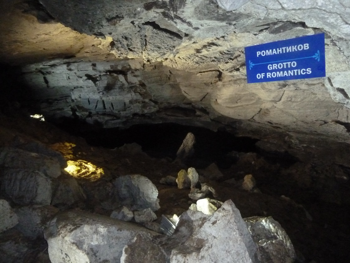 A sign in a cave Description automatically generated with medium confidence